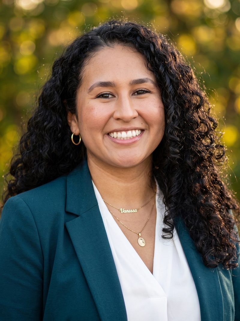 AI headshot of an executive against an out-of-focus fall foliage background